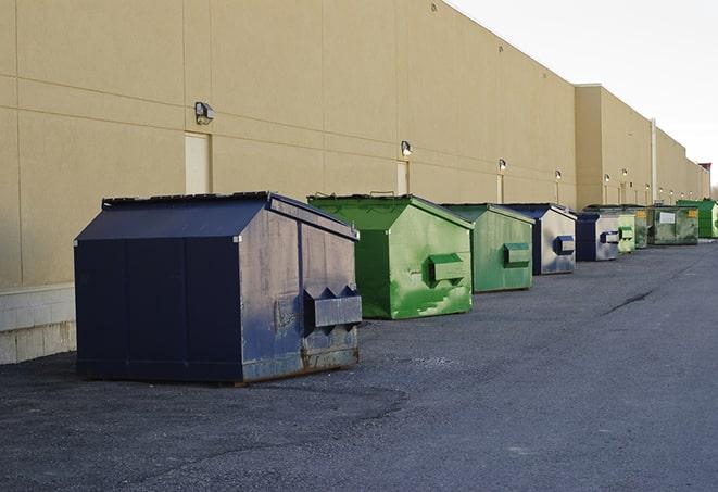 red and green waste bins at a building project in Crystal Springs, MS